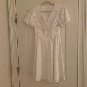 a loves a White eyelet wrap dress